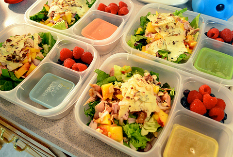 Lunch Boxes with Salads and Fruits